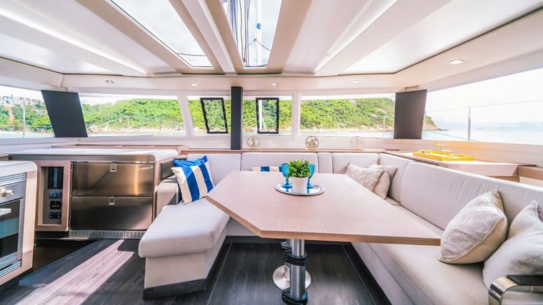 The saloon with dining table and panoramic windows