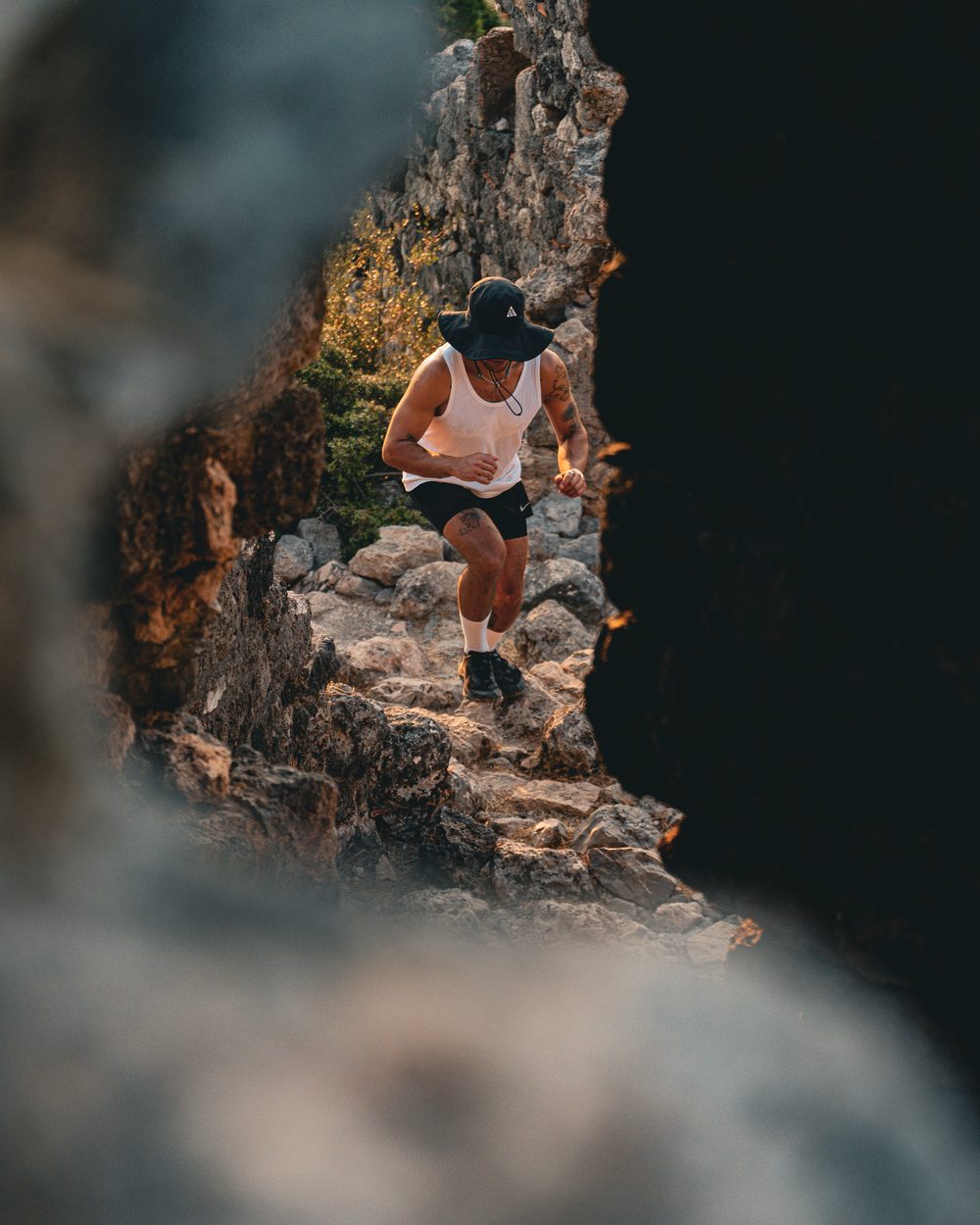 A runner descending a rocky section of the Lycian Way at first light