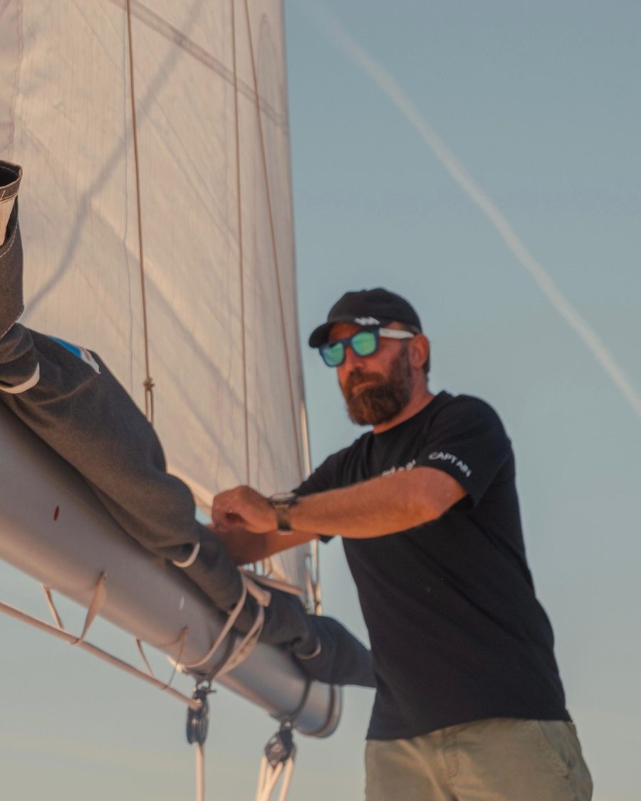 Ismail at the mast, trimming the mainsail