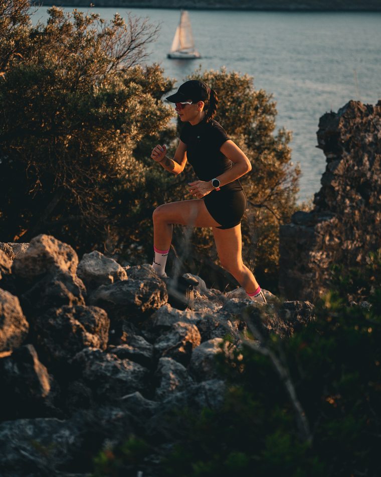 A runner on the rocks above the bay at Göcek