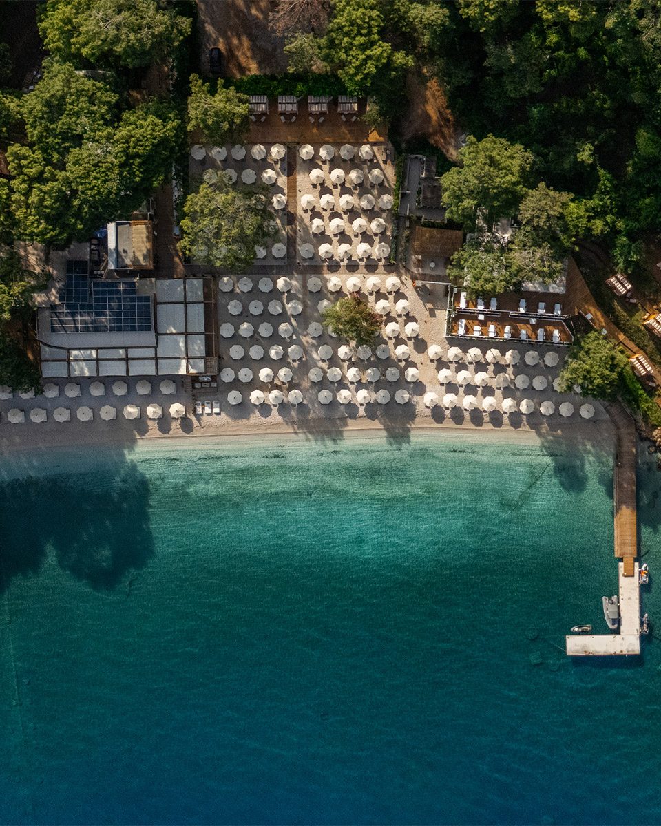 So Beach from the air, loungers along a sheltered cove