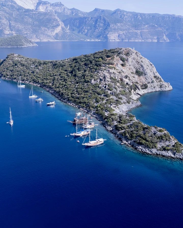 St. Nicholas island from the air, boats along the channel